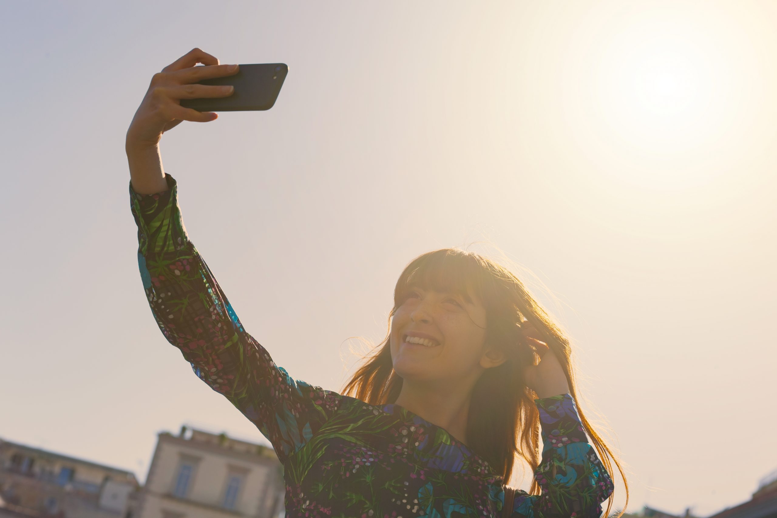 Beautiful young woman takes a selfie in Naples.
