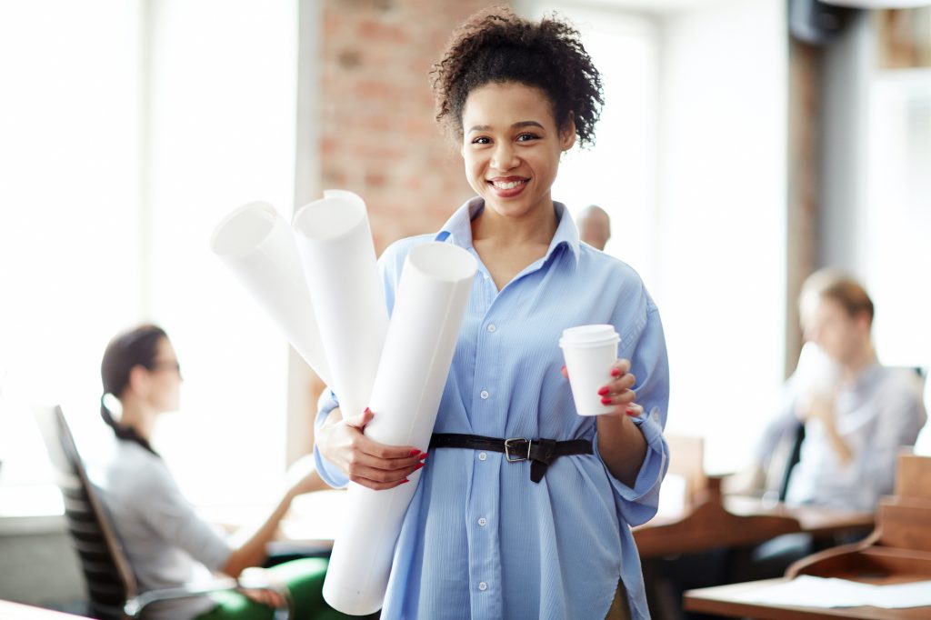 Young designer standing at office