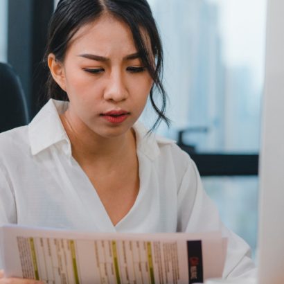 millennial-young-chinese-businesswoman-working-stress-out-with-project-research-problem-computer-desktop-meeting-room-small-modern-office-asia-people-occupational-burnout-syndrome-concept